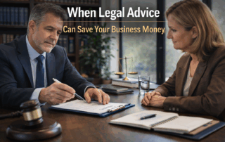Business lawyer reviewing a contract with a business owner in an office, illustrating how legal advice can help save a business money